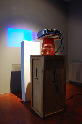 Locky Morris: Off the shoulder number, 2008, video projector, sign holder, text on overhead projection sheet, DVD, dimensions variable; courtesy mother’s tankstation